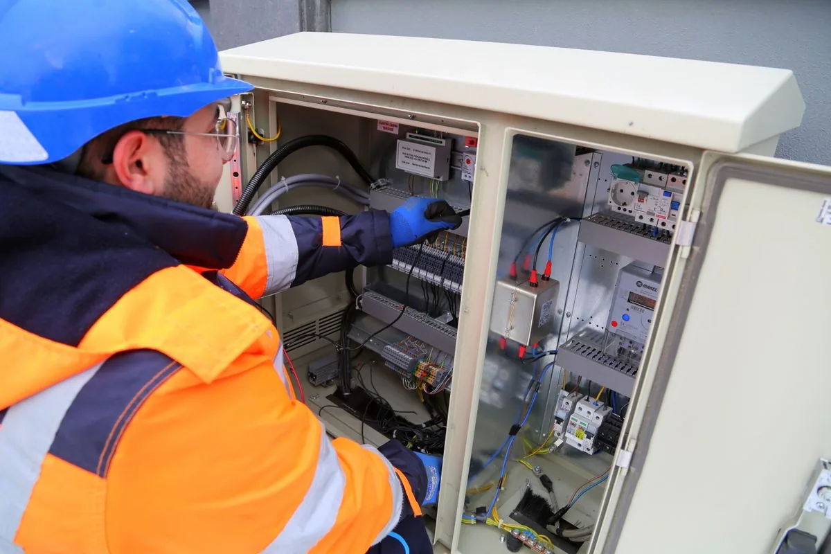 Technician working on an electrical panel